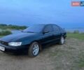 Зеленый Тойота Карина, объемом двигателя 2 л и пробегом 381 тыс. км за 1800 $, фото 1 на Automoto.ua