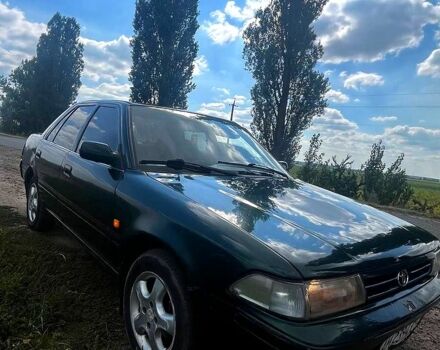 Зеленый Тойота Карина, объемом двигателя 1.6 л и пробегом 200 тыс. км за 800 $, фото 1 на Automoto.ua