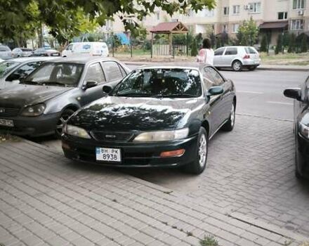 Зеленый Тойота Карина, объемом двигателя 2 л и пробегом 450 тыс. км за 3500 $, фото 1 на Automoto.ua