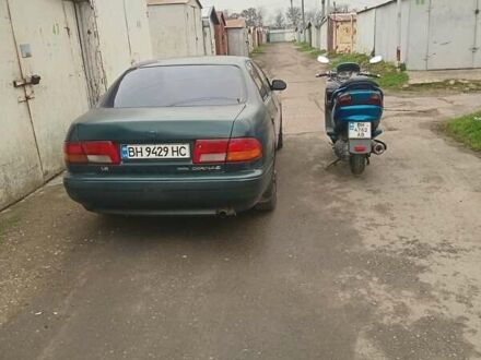 Зеленый Тойота Карина, объемом двигателя 1.76 л и пробегом 345 тыс. км за 3500 $, фото 1 на Automoto.ua