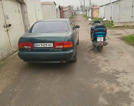 Зеленый Тойота Карина, объемом двигателя 1.76 л и пробегом 345 тыс. км за 3500 $, фото 1 на Automoto.ua