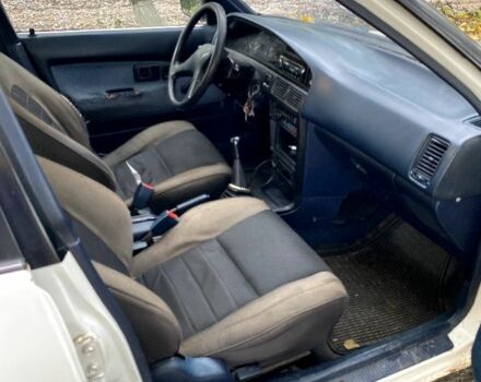 Белый Тойота Королла, объемом двигателя 1.6 л и пробегом 490 тыс. км за 850 $, фото 4 на Automoto.ua