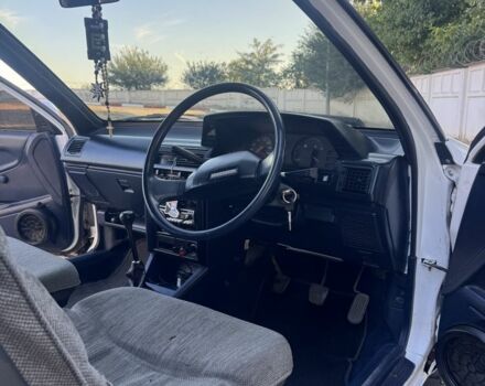 Белый Тойота Королла, объемом двигателя 1.3 л и пробегом 235 тыс. км за 1350 $, фото 11 на Automoto.ua