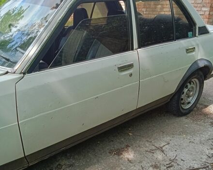 Белый Тойота Королла, объемом двигателя 1.3 л и пробегом 238 тыс. км за 595 $, фото 4 на Automoto.ua