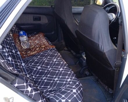 Белый Тойота Королла, объемом двигателя 1.3 л и пробегом 360 тыс. км за 1850 $, фото 5 на Automoto.ua