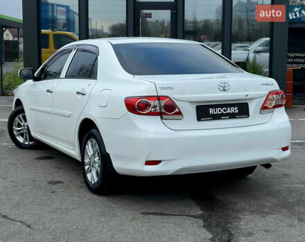 Білий Тойота Королла, об'ємом двигуна 1.33 л та пробігом 243 тис. км за 7399 $, фото 3 на Automoto.ua