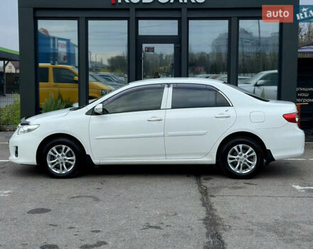 Білий Тойота Королла, об'ємом двигуна 1.33 л та пробігом 243 тис. км за 7399 $, фото 2 на Automoto.ua