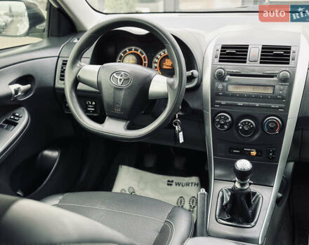 Білий Тойота Королла, об'ємом двигуна 1.33 л та пробігом 243 тис. км за 7399 $, фото 25 на Automoto.ua