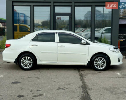 Білий Тойота Королла, об'ємом двигуна 1.33 л та пробігом 243 тис. км за 7399 $, фото 5 на Automoto.ua