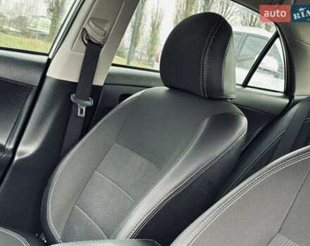 Білий Тойота Королла, об'ємом двигуна 1.33 л та пробігом 243 тис. км за 7399 $, фото 19 на Automoto.ua