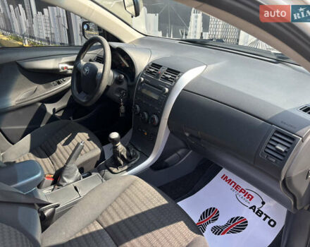 Білий Тойота Королла, об'ємом двигуна 1.33 л та пробігом 210 тис. км за 7000 $, фото 15 на Automoto.ua