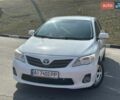 Белый Тойота Королла, объемом двигателя 1.33 л и пробегом 180 тыс. км за 7500 $, фото 1 на Automoto.ua