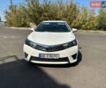 Білий Тойота Королла, об'ємом двигуна 1.33 л та пробігом 170 тис. км за 9300 $, фото 1 на Automoto.ua