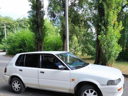 Белый Тойота Королла, объемом двигателя 1.3 л и пробегом 214 тыс. км за 1400 $, фото 1 на Automoto.ua