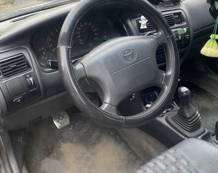 Черный Тойота Королла, объемом двигателя 1.33 л и пробегом 320 тыс. км за 2500 $, фото 2 на Automoto.ua