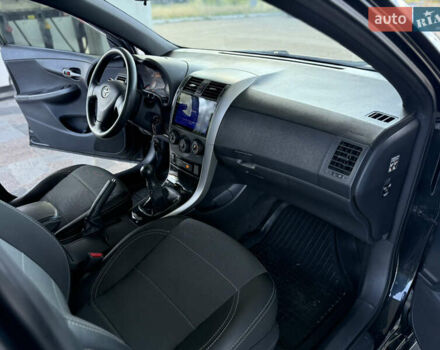 Чорний Тойота Королла, об'ємом двигуна 1.6 л та пробігом 221 тис. км за 6799 $, фото 4 на Automoto.ua