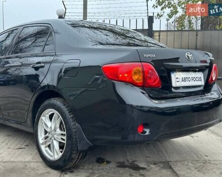 Чорний Тойота Королла, об'ємом двигуна 1.6 л та пробігом 316 тис. км за 7490 $, фото 7 на Automoto.ua