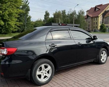 Черный Тойота Королла, объемом двигателя 1.33 л и пробегом 238 тыс. км за 9500 $, фото 1 на Automoto.ua