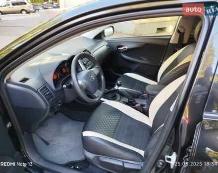Чорний Тойота Королла, об'ємом двигуна 1.33 л та пробігом 124 тис. км за 7200 $, фото 9 на Automoto.ua