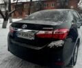 Чорний Тойота Королла, об'ємом двигуна 1.3 л та пробігом 218 тис. км за 9400 $, фото 4 на Automoto.ua