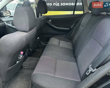 Чорний Тойота Королла, об'ємом двигуна 2 л та пробігом 330 тис. км за 5900 $, фото 9 на Automoto.ua