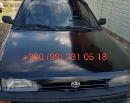 Черный Тойота Королла, объемом двигателя 1.3 л и пробегом 300 тыс. км за 800 $, фото 1 на Automoto.ua