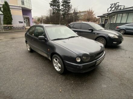 Черный Тойота Королла, объемом двигателя 1.4 л и пробегом 445 тыс. км за 2400 $, фото 1 на Automoto.ua