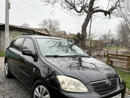 Чорний Тойота Королла, об'ємом двигуна 2 л та пробігом 300 тис. км за 4200 $, фото 1 на Automoto.ua
