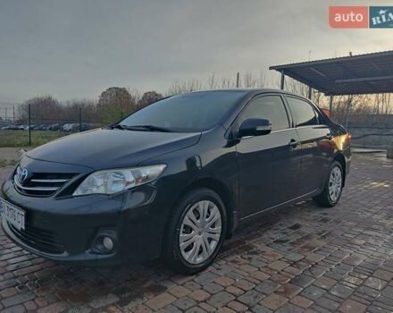 Черный Тойота Королла, объемом двигателя 1.6 л и пробегом 244 тыс. км за 8400 $, фото 1 на Automoto.ua