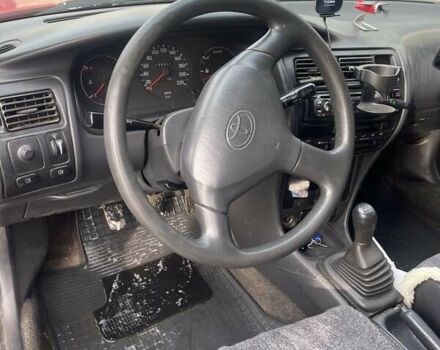 Красный Тойота Королла, объемом двигателя 1.3 л и пробегом 430 тыс. км за 1900 $, фото 6 на Automoto.ua