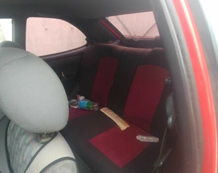 Червоний Тойота Королла, об'ємом двигуна 1.3 л та пробігом 289 тис. км за 2100 $, фото 7 на Automoto.ua