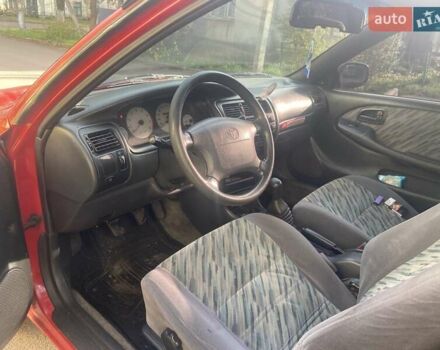 Красный Тойота Королла, объемом двигателя 1.3 л и пробегом 300 тыс. км за 2850 $, фото 6 на Automoto.ua