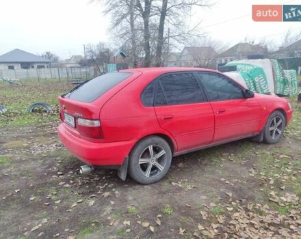 Красный Тойота Королла, объемом двигателя 1.3 л и пробегом 270 тыс. км за 3000 $, фото 2 на Automoto.ua