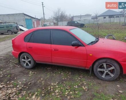 Красный Тойота Королла, объемом двигателя 1.3 л и пробегом 270 тыс. км за 3000 $, фото 1 на Automoto.ua