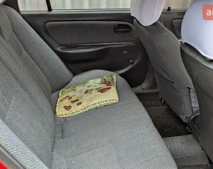 Красный Тойота Королла, объемом двигателя 1.3 л и пробегом 400 тыс. км за 2000 $, фото 2 на Automoto.ua