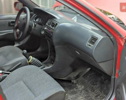 Красный Тойота Королла, объемом двигателя 1.3 л и пробегом 400 тыс. км за 2000 $, фото 1 на Automoto.ua