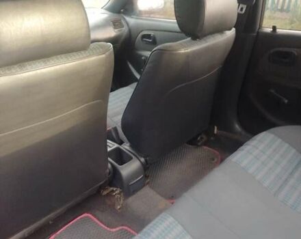 Красный Тойота Королла, объемом двигателя 1.3 л и пробегом 396 тыс. км за 2500 $, фото 4 на Automoto.ua