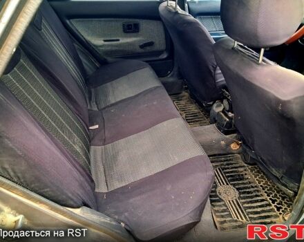 Сірий Тойота Королла, об'ємом двигуна 1.3 л та пробігом 236 тис. км за 900 $, фото 5 на Automoto.ua