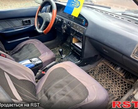 Сірий Тойота Королла, об'ємом двигуна 1.3 л та пробігом 236 тис. км за 900 $, фото 4 на Automoto.ua