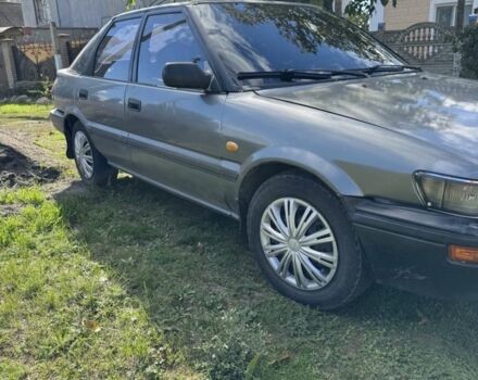 Серый Тойота Королла, объемом двигателя 1.3 л и пробегом 350 тыс. км за 1750 $, фото 1 на Automoto.ua