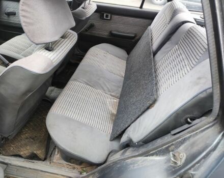 Серый Тойота Королла, объемом двигателя 1.3 л и пробегом 300 тыс. км за 238 $, фото 5 на Automoto.ua