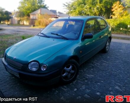 Зелений Тойота Королла, об'ємом двигуна 1.3 л та пробігом 215 тис. км за 1850 $, фото 2 на Automoto.ua