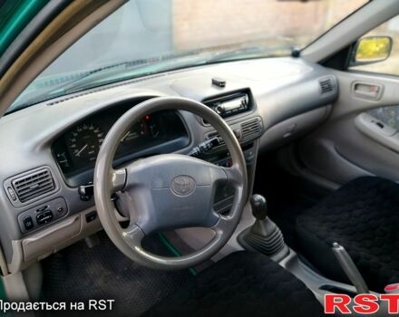 Зелений Тойота Королла, об'ємом двигуна 1.3 л та пробігом 215 тис. км за 1850 $, фото 3 на Automoto.ua