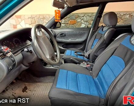 Зеленый Тойота Королла, объемом двигателя 1.3 л и пробегом 300 тыс. км за 3000 $, фото 3 на Automoto.ua