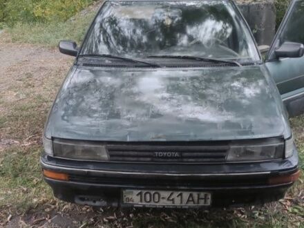 Зеленый Тойота Королла, объемом двигателя 1.3 л и пробегом 200 тыс. км за 400 $, фото 1 на Automoto.ua