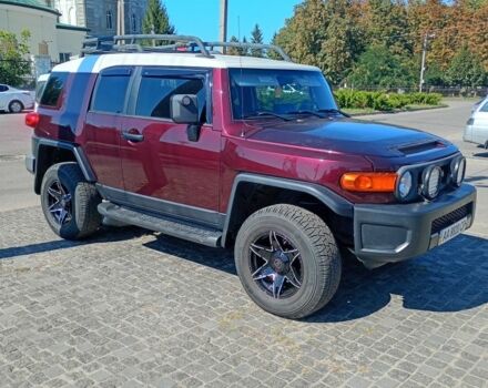 Красный Тойота ФЖ Крузер, объемом двигателя 4 л и пробегом 245 тыс. км за 19500 $, фото 1 на Automoto.ua