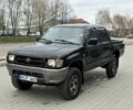 Черный Тойота Хайлюкс, объемом двигателя 2.5 л и пробегом 300 тыс. км за 3750 $, фото 1 на Automoto.ua