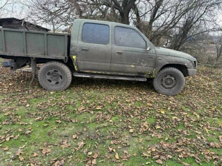 Черный Тойота Хайлюкс, объемом двигателя 2.5 л и пробегом 250 тыс. км за 1001 $, фото 1 на Automoto.ua