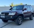 Червоний Тойота Ленд Крузер 100, об'ємом двигуна 4.7 л та пробігом 320 тис. км за 9500 $, фото 1 на Automoto.ua