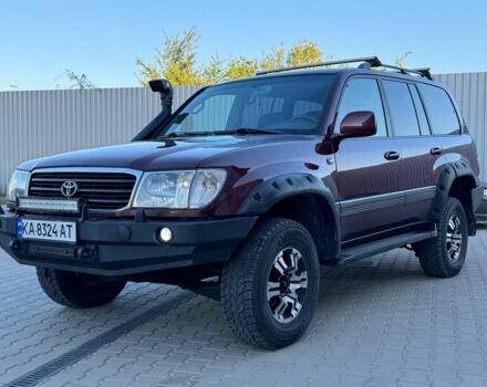 Червоний Тойота Ленд Крузер 100, об'ємом двигуна 4.7 л та пробігом 320 тис. км за 9500 $, фото 1 на Automoto.ua